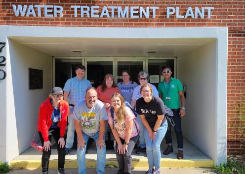 Group of RET members standing in front of the water treatment plant.